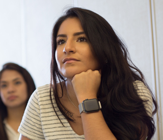 Female student in classroom mobile image