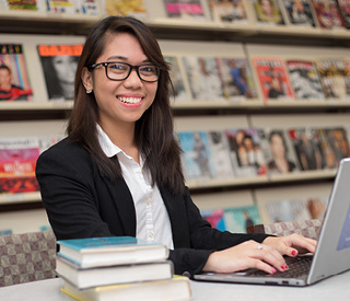 Photo of Berkeley College student on laptop mobile image