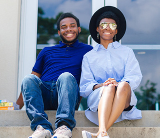 Students sitting outside mobile image