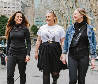 3 female students walking in Bryant Park mobile image