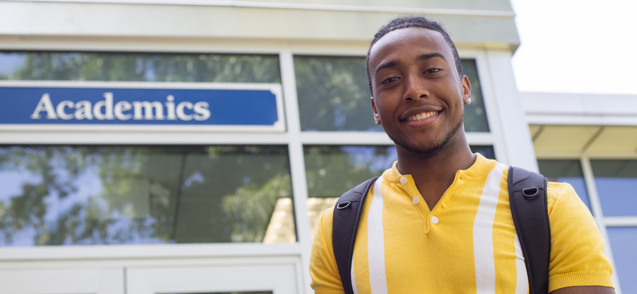 Justin Rickett in from of Academic building