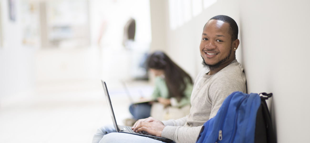 Male student on laptop