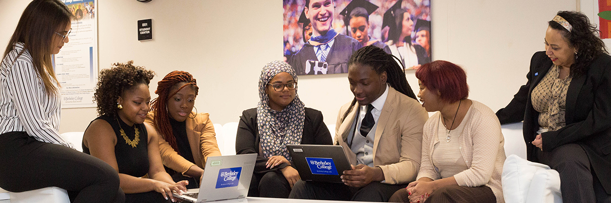 Image: Group of 7 students sitting on couch looking at laptop