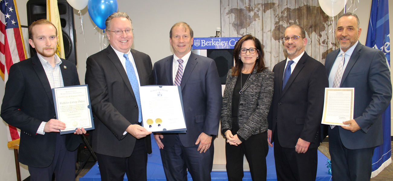 Berkeley College Online staff with proclamation