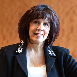 Headshot of Pamela Cohen wearing a black jacket