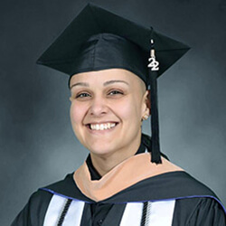 Headshot of Vanessa Guzman in graduation attire