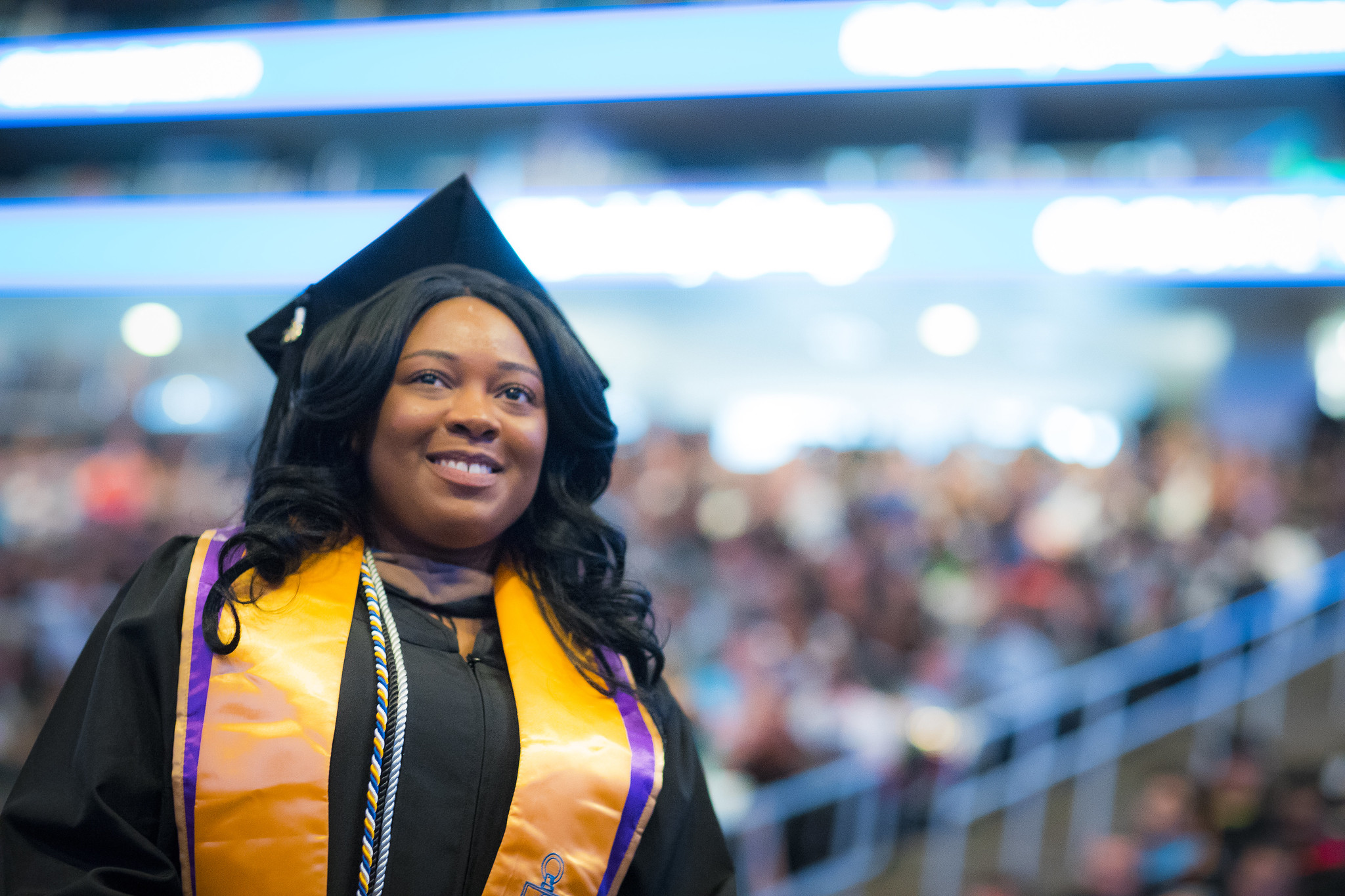 Berkeley graduate in robes looks up