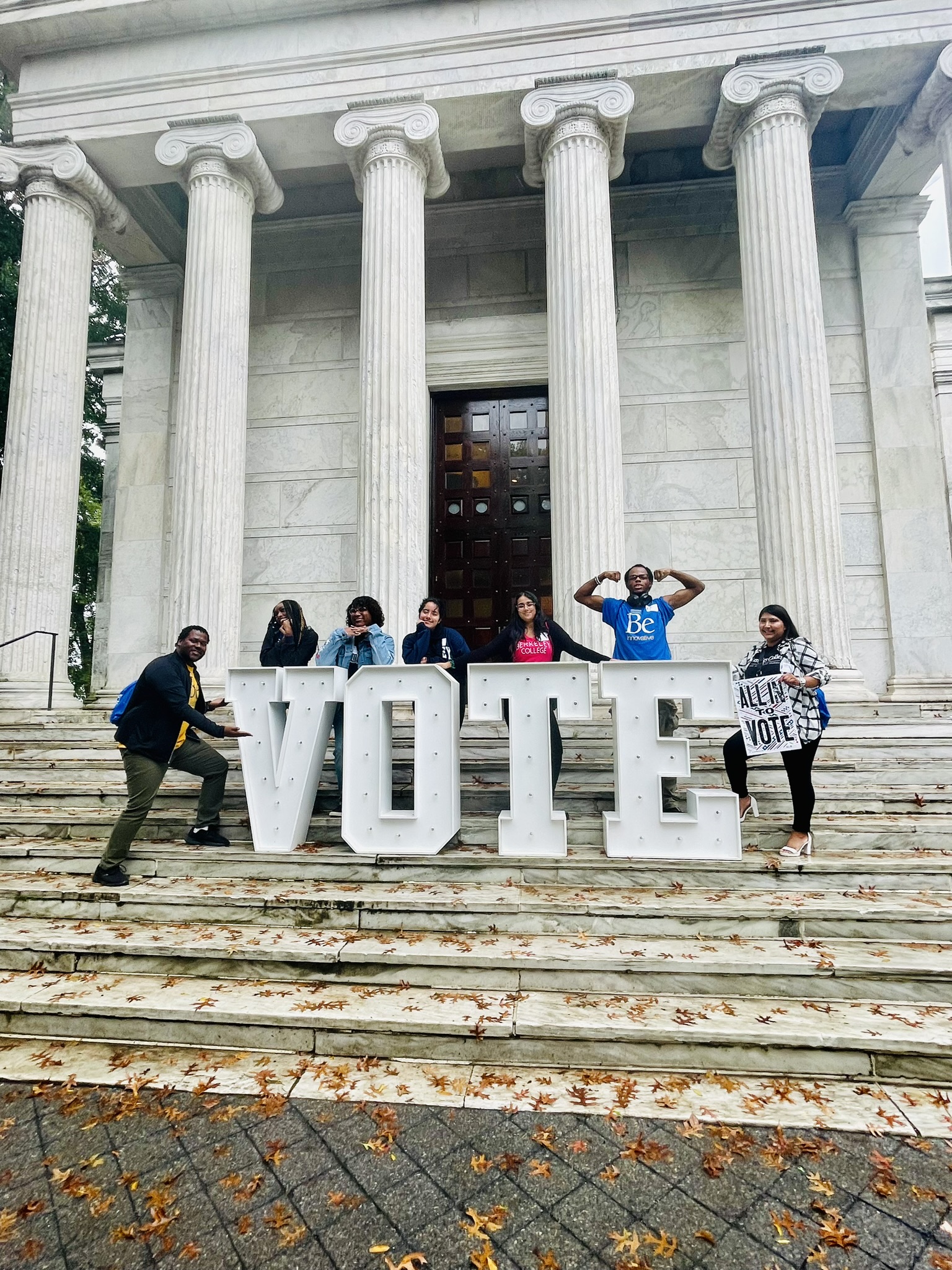 Photo Caption (L to R): James Marshmon, Director, Student Development and Campus Life, Berkeley College; Berkeley College students Mary Dixon, Veronica Suero, and Monserrat “Monse” Miranda; and Aarti Patel, Associate, Office of Government Relations, Berkeley College; and students Jimil Smith and Evelyn Alvarez team up to register voters at the “VOTE” sign at the ALL IN to Vote New Jersey Votes Campus Summit in September 2024 at Princeton University.
