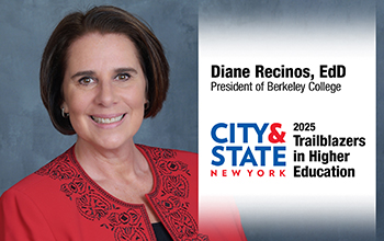 A woman in a red blazer smiling