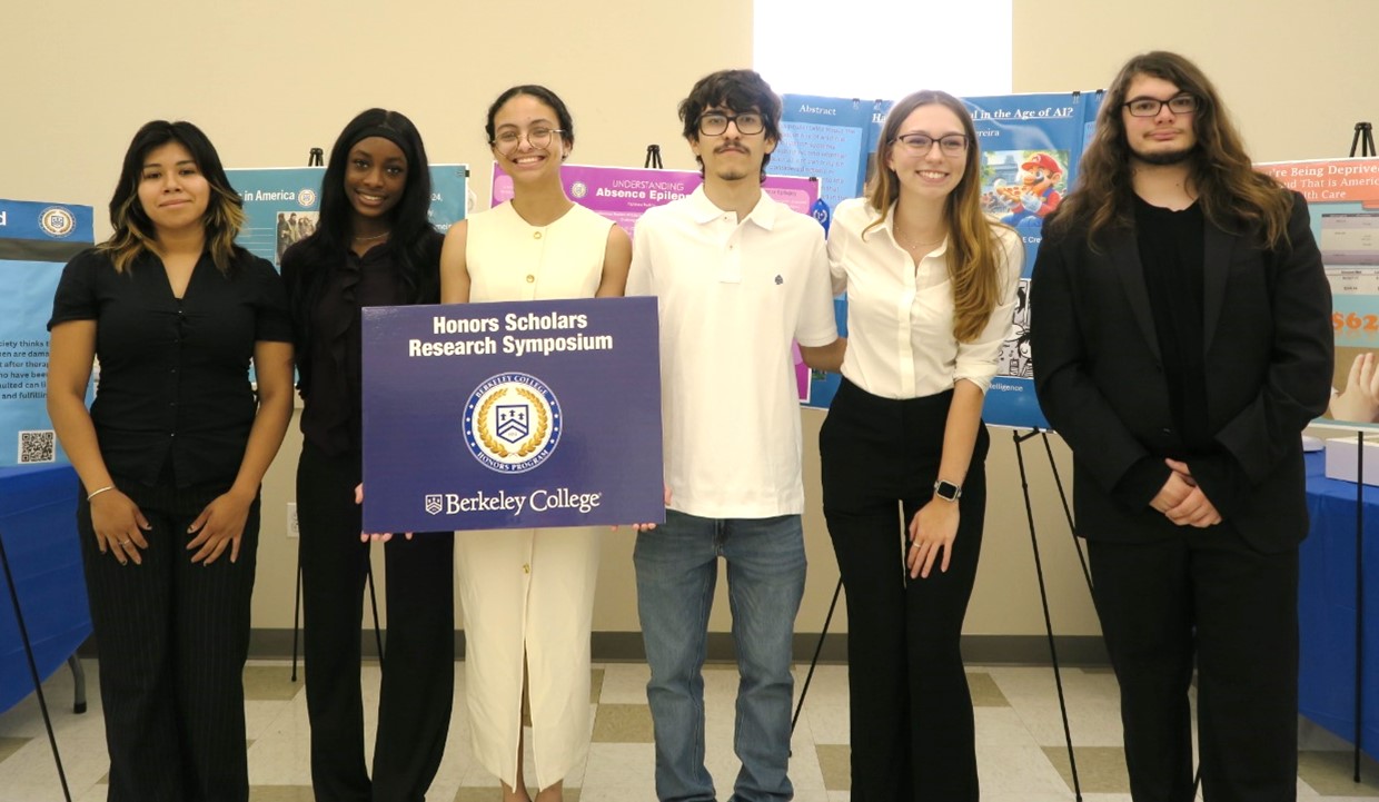 A group of students stands and smiles at a camera.